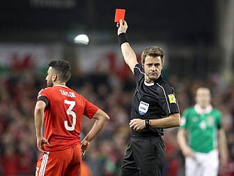 Wales' Neil Taylor faces l...